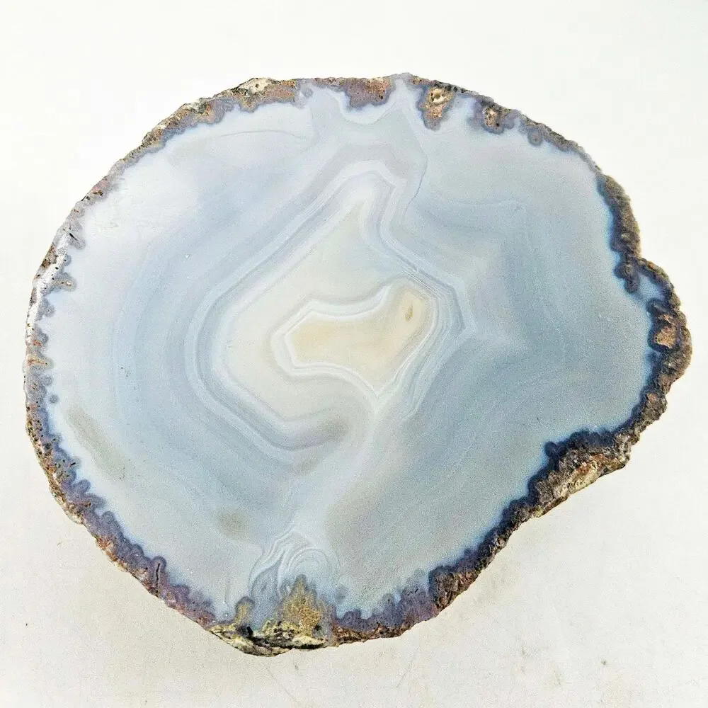 Raw Brazilian polished translucent blue grey agate geode
